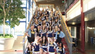 cheer team on sitting on a staircase